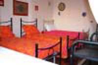 Classic triple with city view, private facilities (bath and shower), and breakfast